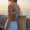 Tiana modest swim dress in Puffy Seashell Ocean with high neckline, fitted silhouette and raised seashell texture.